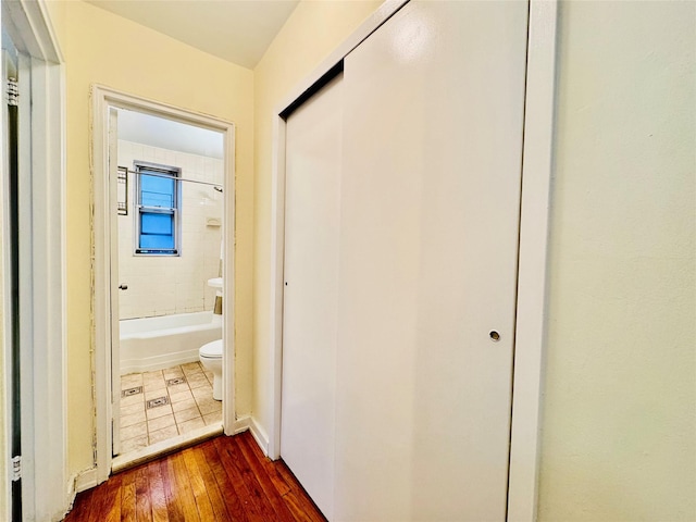 hallway with wood-type flooring