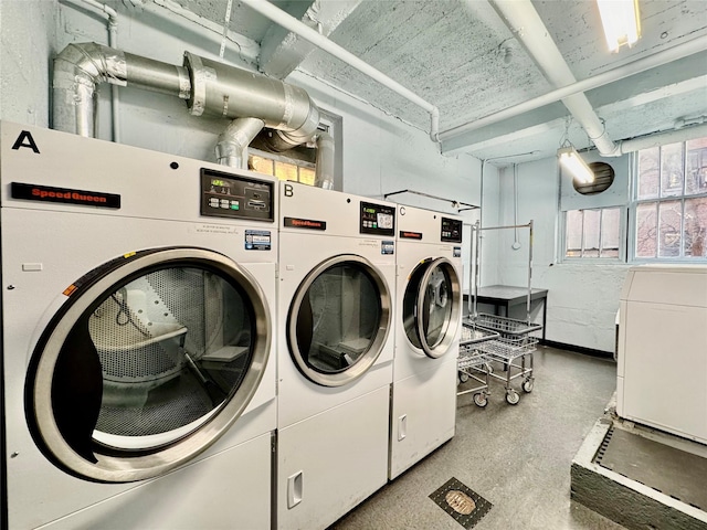 laundry room with separate washer and dryer