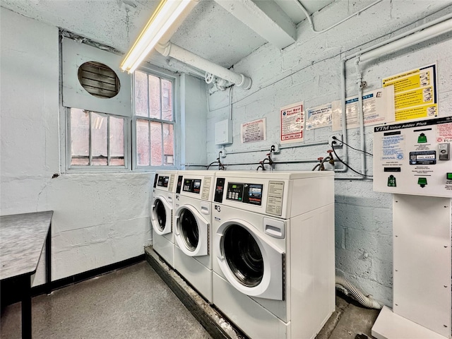 clothes washing area featuring washing machine and clothes dryer