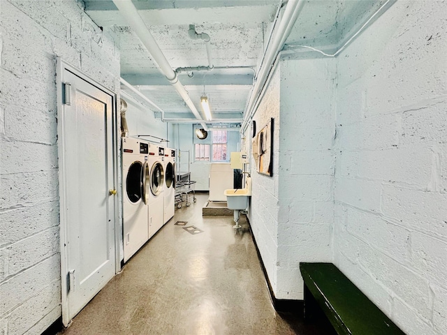 clothes washing area featuring washing machine and clothes dryer