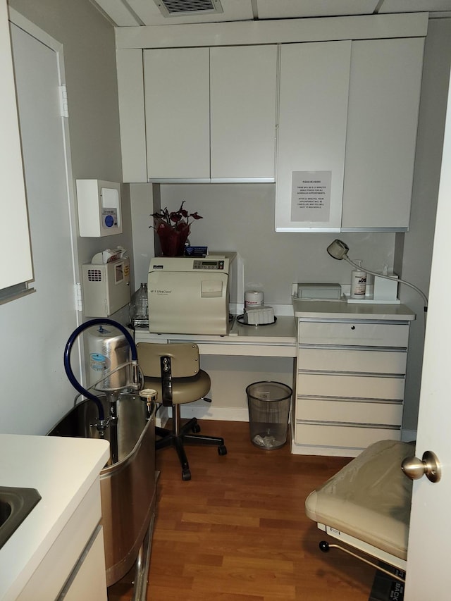 home office with hardwood / wood-style floors