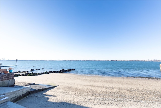 property view of water featuring a beach view