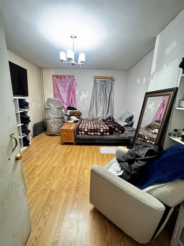 living room featuring hardwood / wood-style floors and a notable chandelier