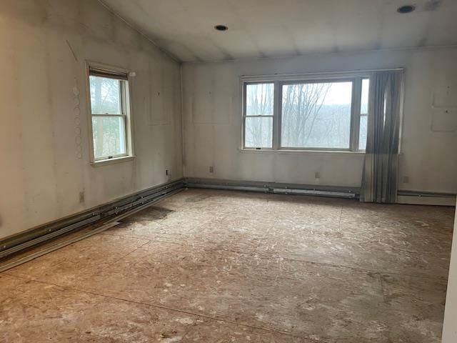 empty room with a baseboard heating unit