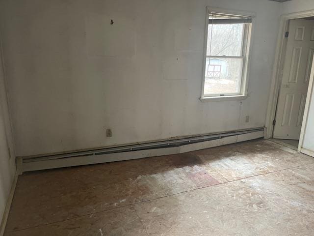 empty room with a baseboard heating unit