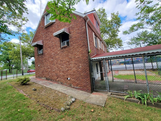 view of property exterior featuring a lawn