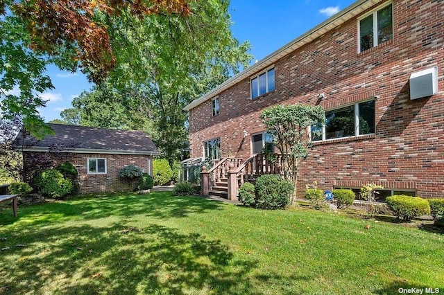 rear view of house with a lawn