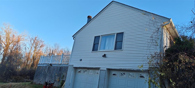 view of side of home with a garage