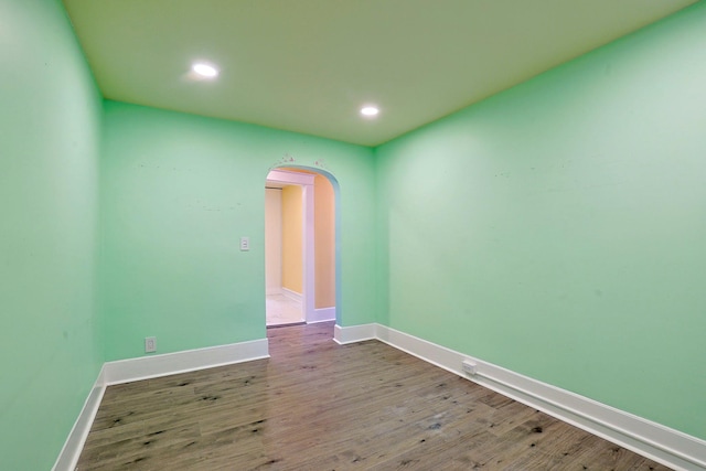 unfurnished room featuring wood-type flooring