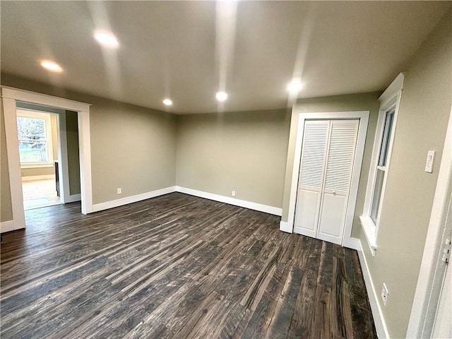 interior space featuring a closet and dark hardwood / wood-style floors