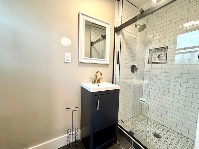 bathroom featuring tile patterned flooring, vanity, and an enclosed shower