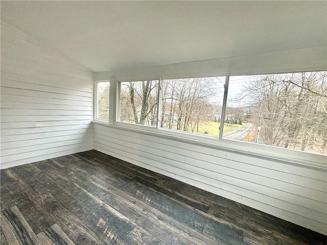 unfurnished sunroom featuring lofted ceiling