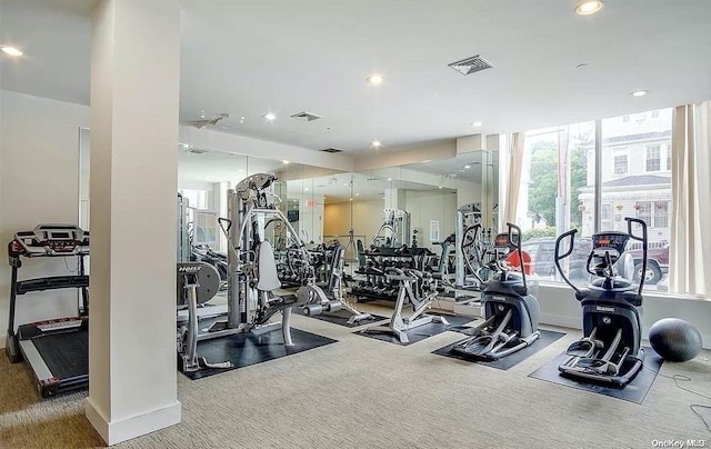 exercise room with carpet flooring