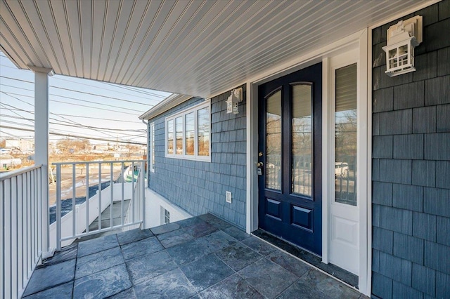 property entrance with covered porch