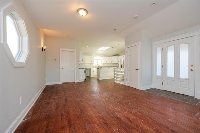 foyer entrance with dark wood-type flooring