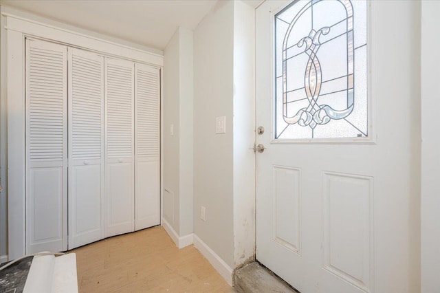 doorway with light wood-type flooring