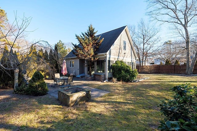 exterior space featuring a patio area and a lawn