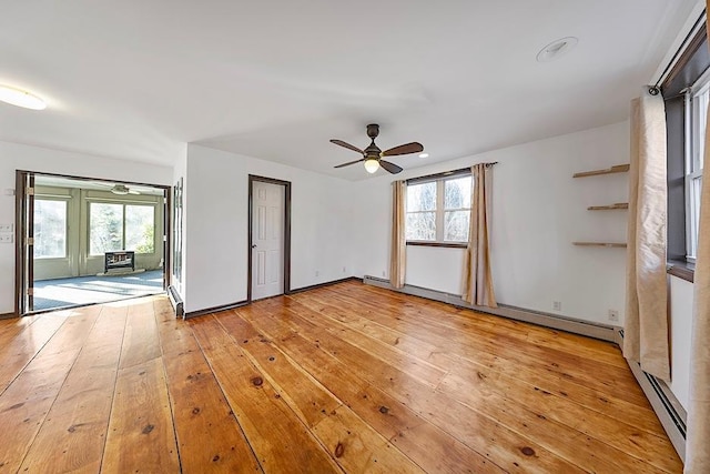 unfurnished bedroom featuring access to outside, baseboard heating, light wood-type flooring, and ceiling fan