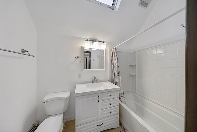 full bathroom featuring tile patterned flooring, vaulted ceiling, shower / bath combination with curtain, toilet, and vanity