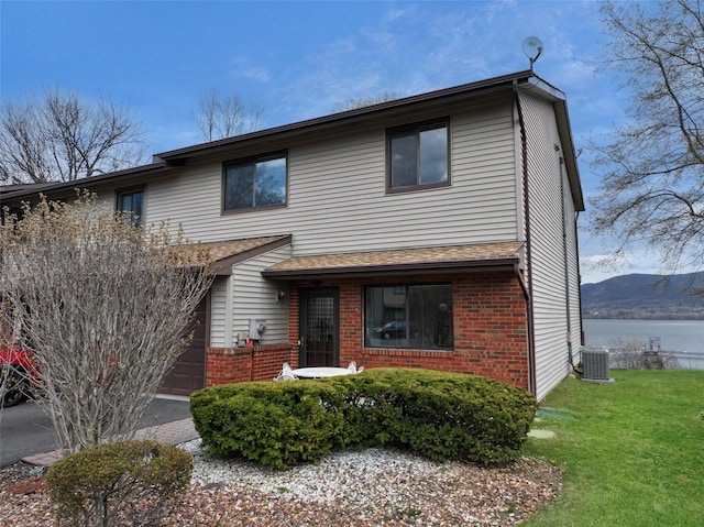 528 Barberry Ln, New Windsor, NY 12553 - traditional home featuring a front lawn, brick siding, and central air condition unit