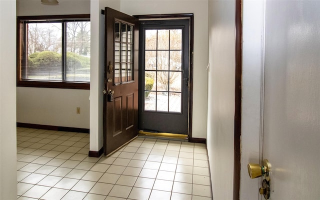 528 Barberry Ln, New Windsor, NY 12553 - doorway to outside featuring baseboards and light tile patterned floors
