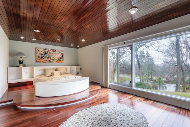 bedroom with wood-type flooring and wooden ceiling