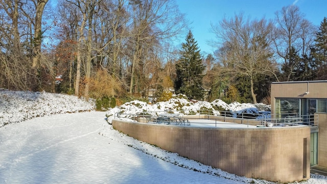 view of snow covered pool