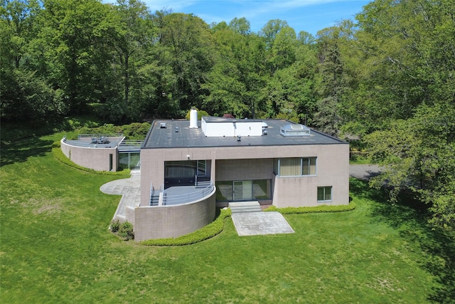 3 Paddock Ct, Old Westbury, NY 11568 - rear view of property with a lawn and a view of trees