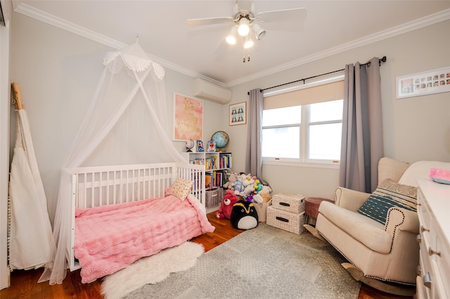 bedroom with hardwood / wood-style floors, ceiling fan, an AC wall unit, and crown molding