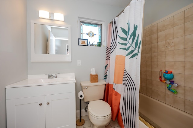 full bathroom with tile patterned floors, shower / bath combo with shower curtain, vanity, and toilet