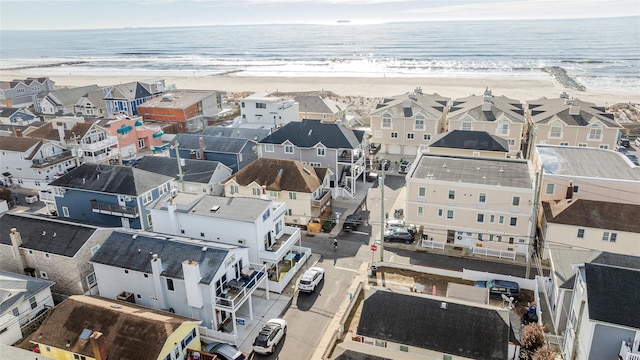 aerial view featuring a water view and a view of the beach