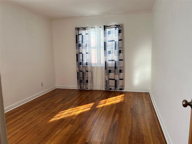 unfurnished room featuring crown molding and dark hardwood / wood-style floors