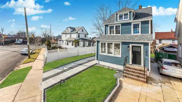 view of front of home with a front yard