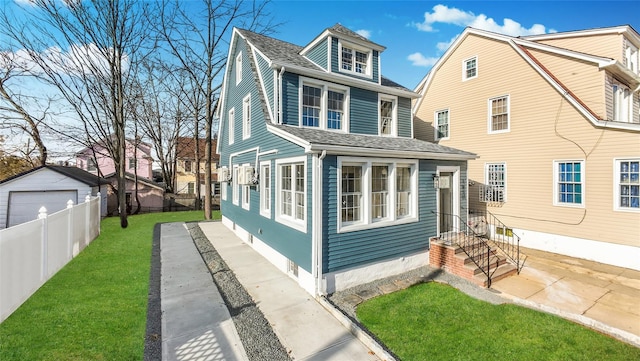 rear view of property featuring a lawn