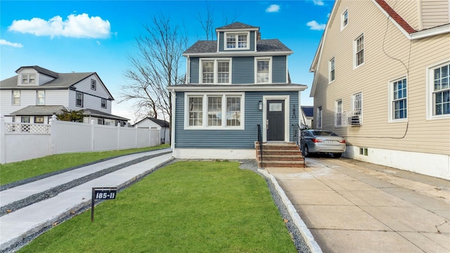 view of front of home with a front lawn