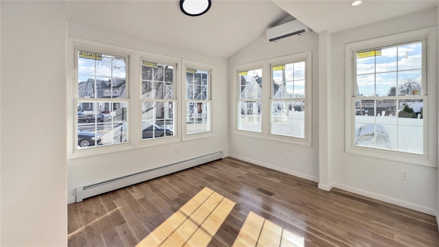 unfurnished sunroom featuring an AC wall unit, plenty of natural light, a baseboard radiator, and vaulted ceiling