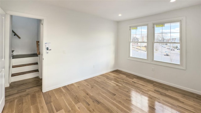 empty room featuring wood-type flooring