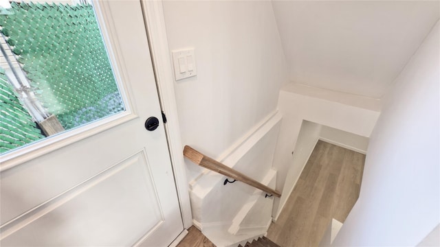 stairs with hardwood / wood-style floors