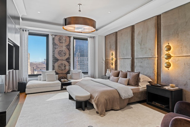 bedroom with a tray ceiling