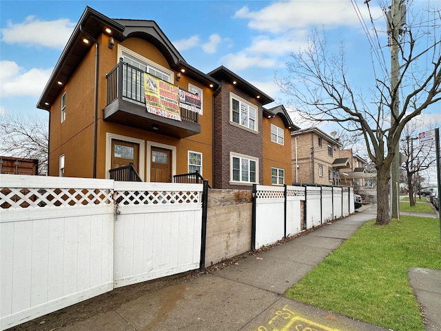 view of property exterior with a balcony