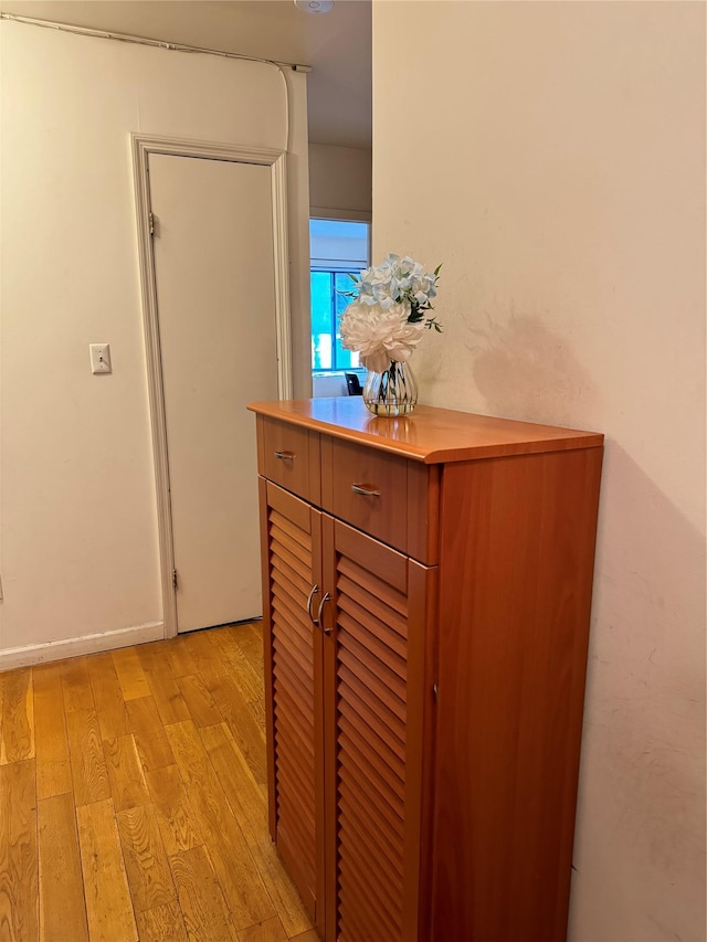 hallway featuring light hardwood / wood-style flooring