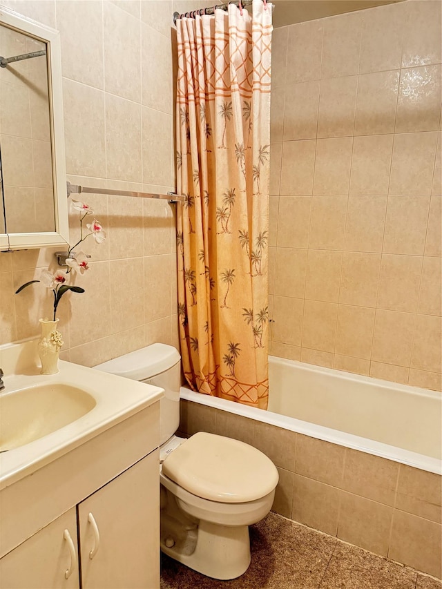 full bathroom with shower / bath combo, vanity, tile walls, and toilet