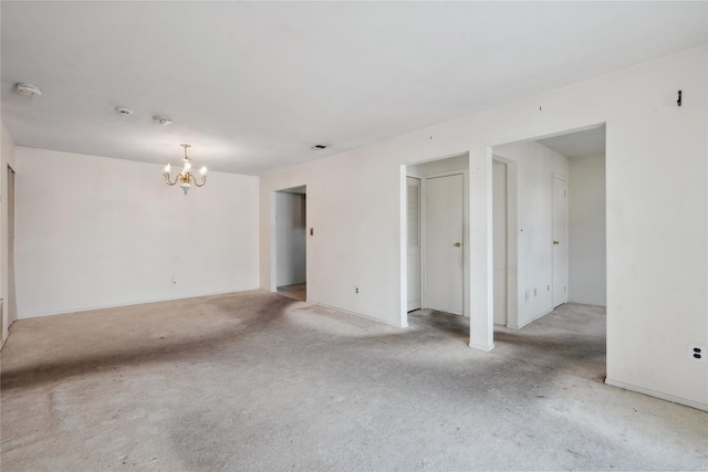 spare room featuring a notable chandelier