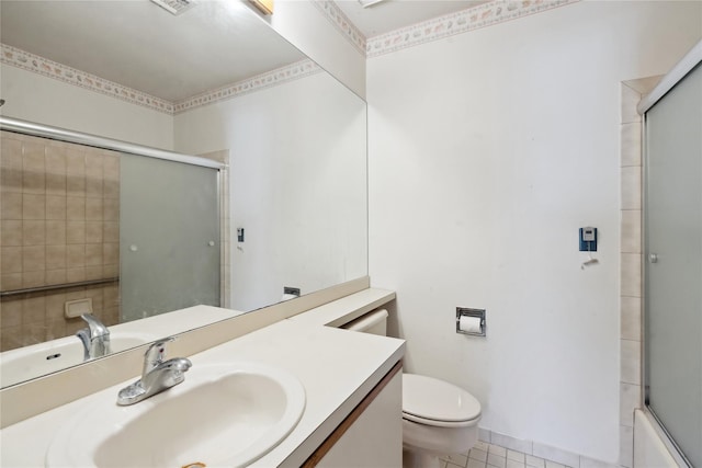 full bathroom featuring tile patterned flooring, vanity, enclosed tub / shower combo, and toilet