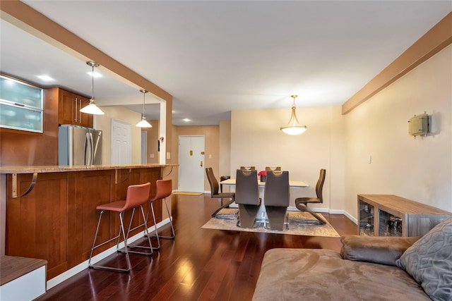 dining room with dark hardwood / wood-style floors