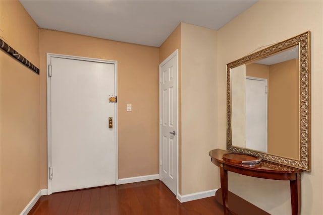 entryway with dark wood-type flooring