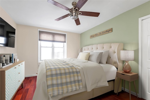 bedroom with ceiling fan and dark wood-type flooring