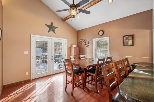 dining room featuring beam ceiling, ceiling fan, french doors, high vaulted ceiling, and hardwood / wood-style floors