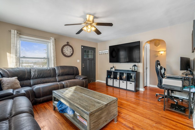 living room featuring ceiling fan and hardwood / wood-style floors