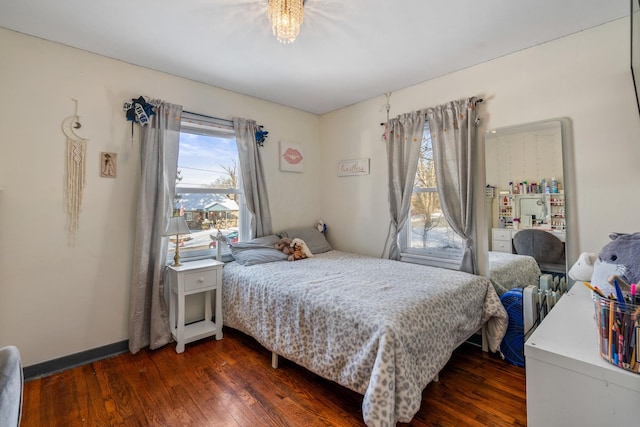 bedroom featuring dark hardwood / wood-style flooring